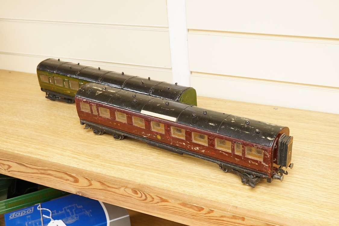 Four 0 gauge 1930s wooden Bonds bogie coaches; three Southern Railway; a Composite Brake, and two First Third Composites, and an LMS First Third Composite